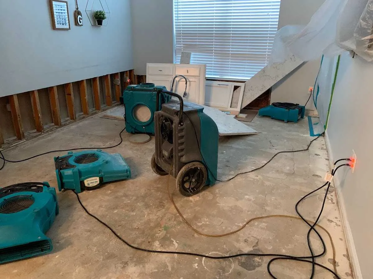 Dehumidifier in flood-cut room for Water Damage Restoration in Rayne